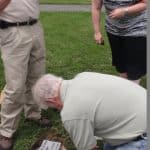 Man setting stone in the ground